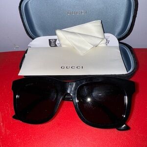 Gucci Sunglasses with Elegant Black and Gold Design
